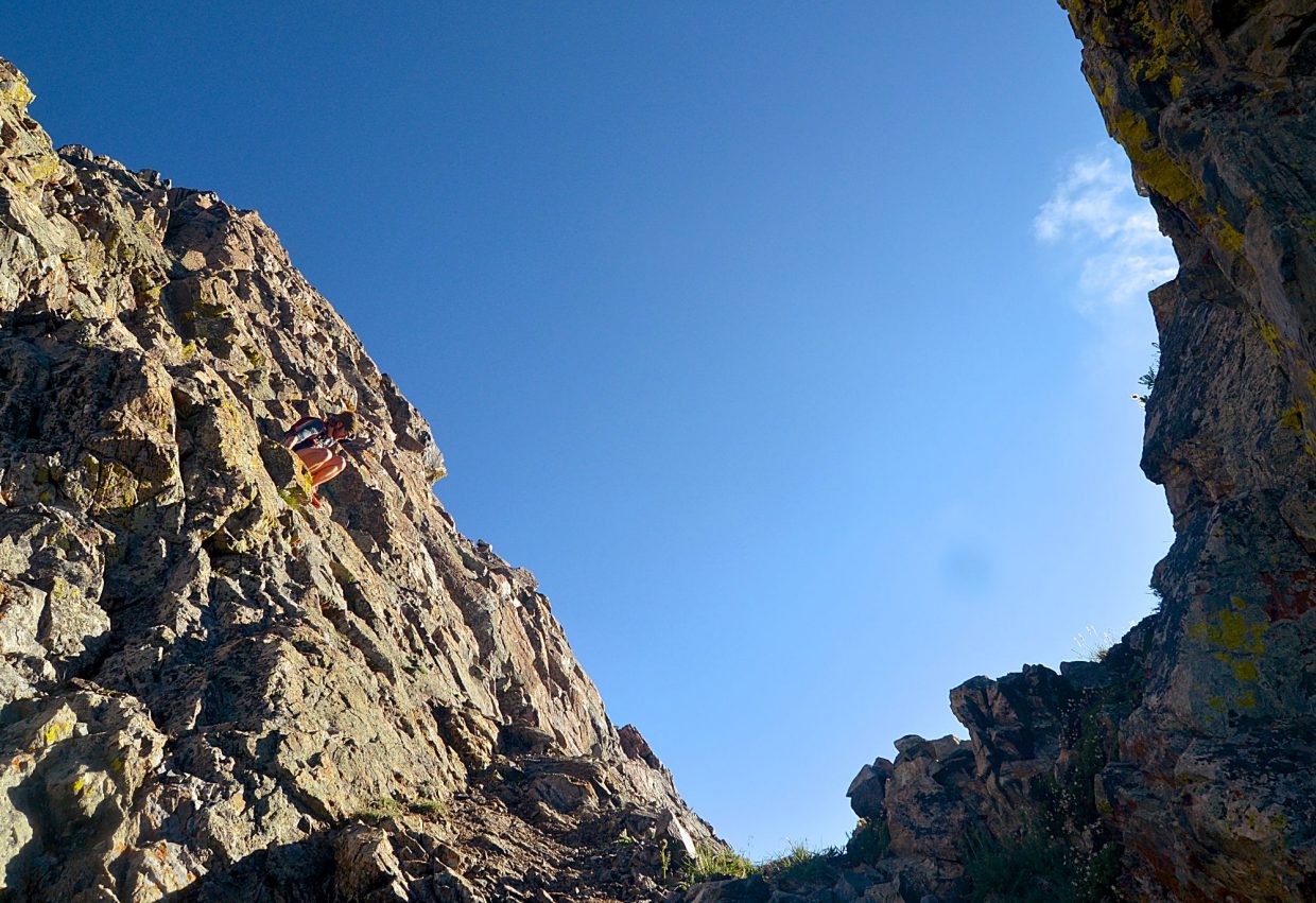 Summit Daily News managing editor Ben Trollinger drops from the Breckenridge side of the Tenmile Range to the Copper Mountain side during an attempt of the Tenmile Traverse. The route from Tenmile Peak (aka Peak Two) to Peak Four requires Class III scrambling over loose boulder fields and precarious ridgelines.