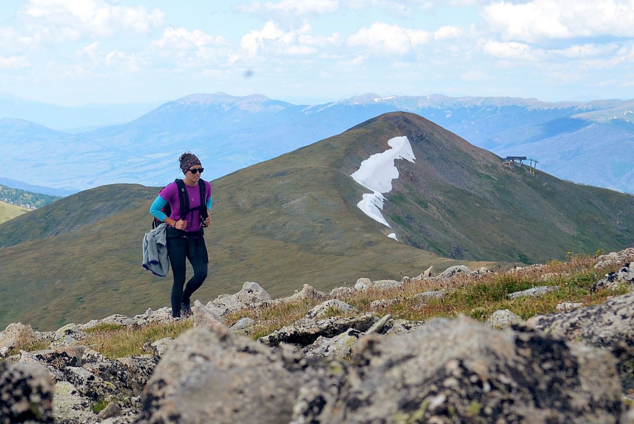 Frisco local Sara Skinner reaches the summit of Peak Nine (13,195 feet) during an attempt of the Tenmile Traverse in August. The upper terminal of Imperial Chair on Peak Eight is in the background.