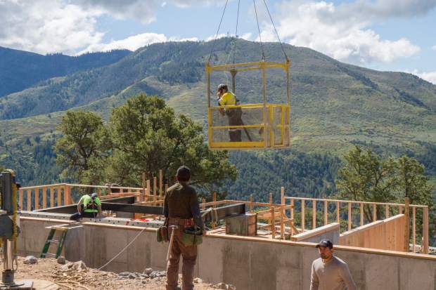 Crews continue work to install the new Haunted Mine Drop on-site at the Glenwood Adventure Park.