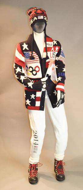 Designed by Ralph Lauren, Team USAâs uniforms featured a patchwork cardigan emblazoned with stars, stripes and the Olympic rings, with all of the pieces produced in the United States. For a hint of nostalgia, the cardigan was paired with a cream turtleneck sweater, white fleece athletic pants and black leather boots with red laces.