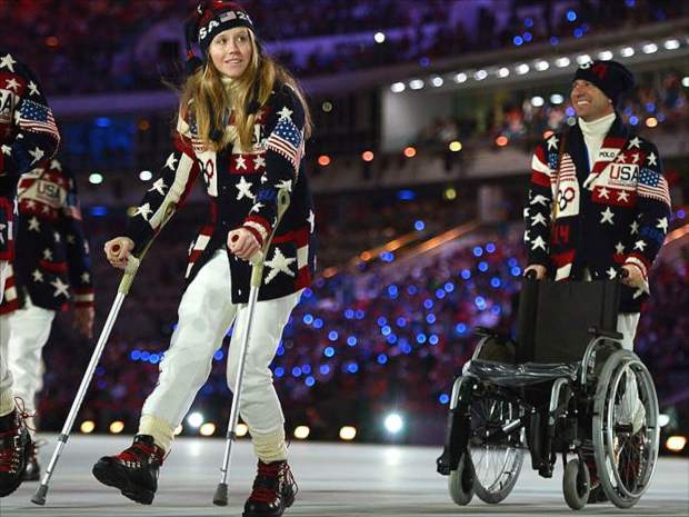 Heidi Kloser joined her American teammates in the 2014 Olympic Games Opening Ceremonies parade, albeit hobbling along on crutches.
