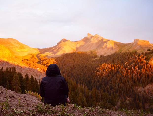 Redirected light from the evening's radiant alpenglow painted colors on the mountains crossed earlier in the day.