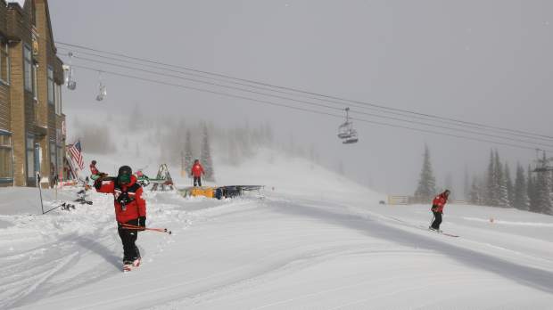 Skiers take to groomed trails early Saturday morning at Breckenridge Ski Resort after Friday's storm dumped a foot of snow at Breckenridge.