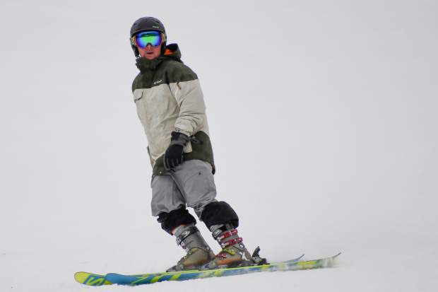 Snowboarders and skiers make their way down the slope during opening day at Sunlight Mountain Resort on Thursday.