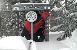 A Steamboat Ski Patrol member clears snow Wednesday from the Powder Cam.