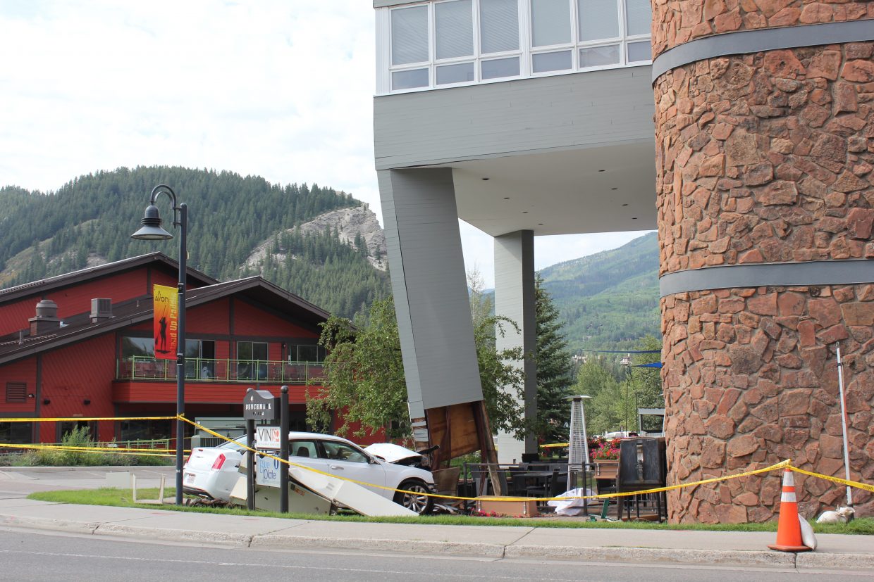This Chrysler 300 rental car rolled over a road sign and into Avon's Benchmark Plaza building, damaging a structural column that helps support the second and third floors. The building has been evacuated. The accident happened around 8 a.m. Friday. No alcohol is thought to be involved, authorities said.