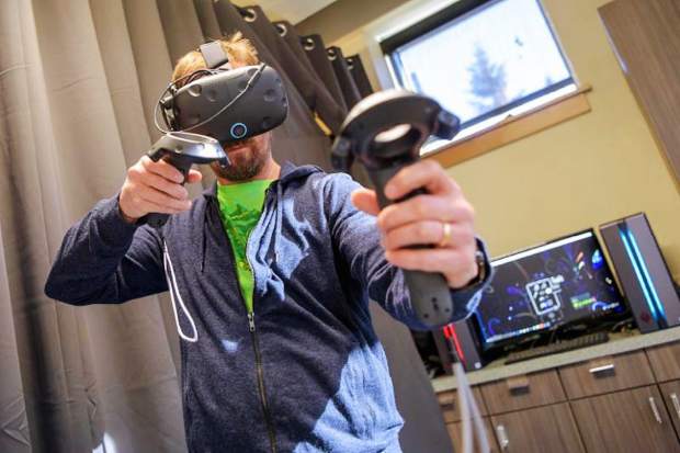 Virtual reality experiences at the Imagination Station in Vail include slicing fruit with a virtual sword and painting in 3-D in outer space.