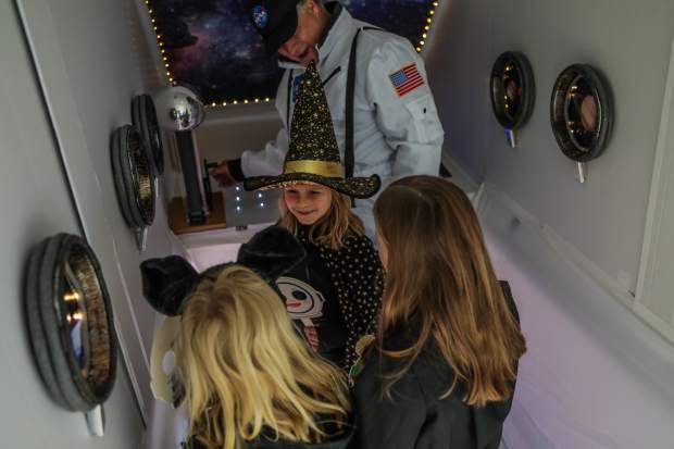 Amelia and Lily Linton and Samantha Conlin of East Vail check out the space ship for the Walking Mountains Science Center Fright at the Museum Saturday, Oct. 27, in Avon. The station taught kids about static electricity.