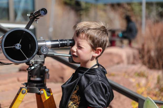 William Geoger of Gypsum checks out the telescope at the Walking Mountains Science Center Fright at the Museum Saturday, Oct. 27, in Avon. Different telescopes include one to look directly at the sun with a special lens.