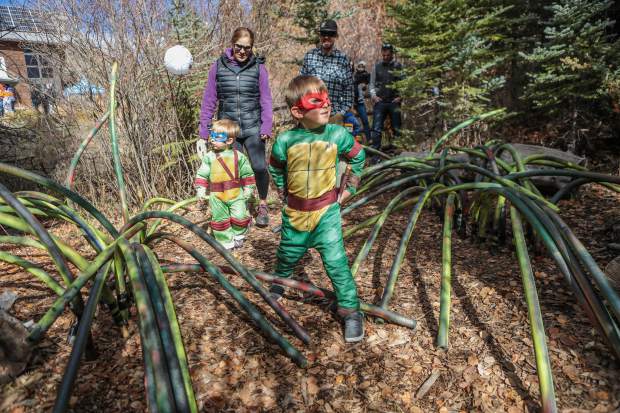 Kids walk through the haunted forest at the Walking Mountains Science Center Fright at the Museum Saturday, Oct. 27, in Avon. The walk featured information on the planets, and kids had to watch out for rogue aliens.