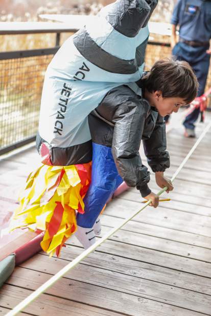 Tommy Tvarkunas, 8, blasts off on his space walk at the Walking Mountains Science Center Fright at the Museum Saturday, Oct. 27, in Avon. Kids could go to astronaut school before taking their space walk.