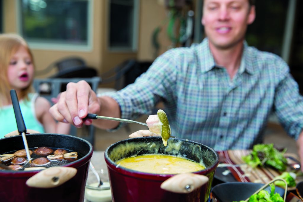 Half the fun of the fondue meal offered by Fondue at Home is making creative combninations for your fondue dip, like ham and cornichons.