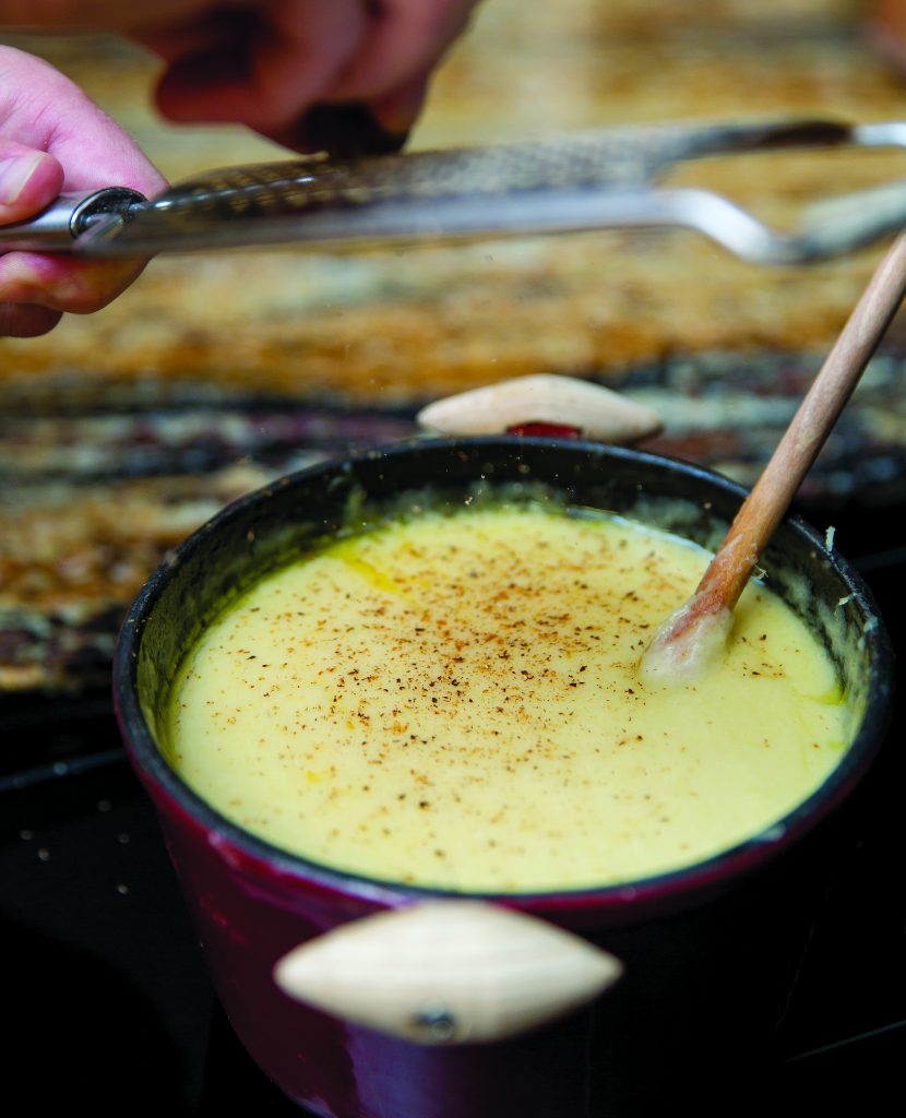 Fresh nutmeg adds a secret spice to the cheese fondue mix served by Fondue at Home.