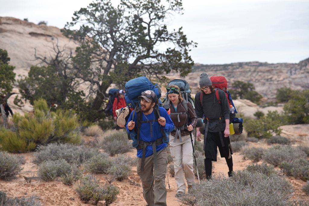 Colorado Mountain College’s canyon orientation courses explore the geology, geography and ecology of canyon country. Here, during the 2018 spring semester, Steamboat Springs students Bill Payne, Nicole Eaton and Cooper Scherer hike through Utah's Dark Canyon Wilderness. Elevation Outdoors magazine just named CMC Top Adventure College for the second year in a row.  