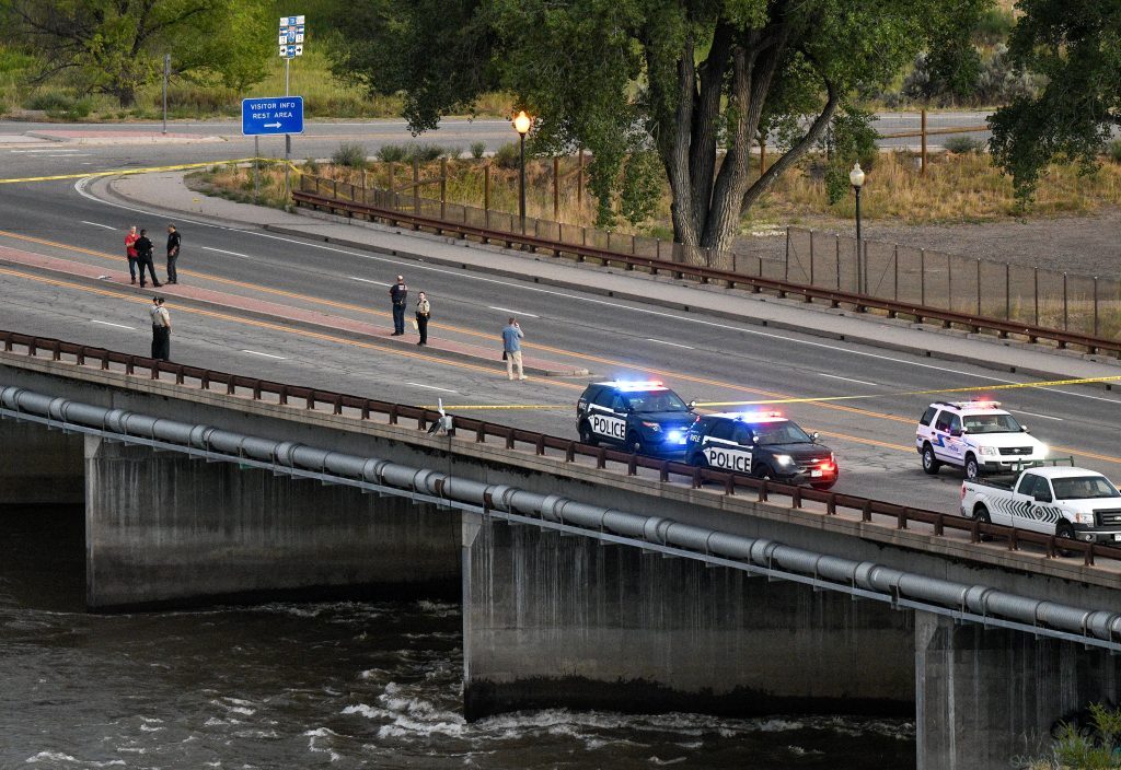 Rifle man shot by police pointed gun at himself before running ...
