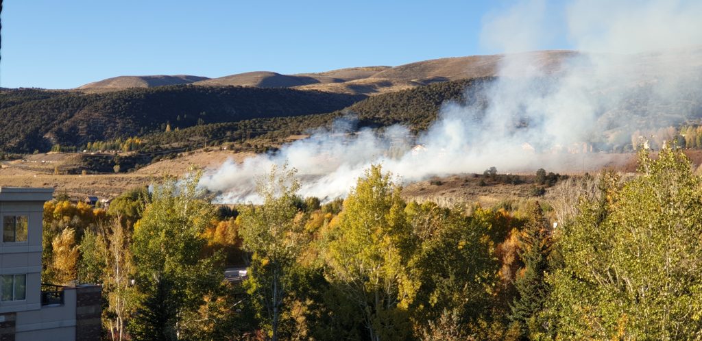 A view from the Riverwalk of Thursday's wildfire in Edwards. The blaze scorched 4 acres before firefighters contatined it.