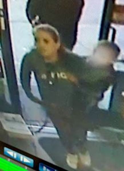 This woman is suspected of being with the man at the time of the robbery.