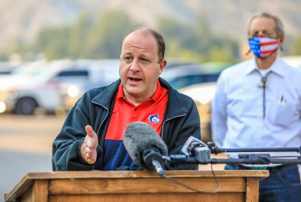 Colorado Gov. Jared Polis speaks to the media for updates on the Grizzly Creek Fire Friday at the Eagle County Fairgrounds in Eagle. The fire is now more than 14,000 acres with 1% containment. 