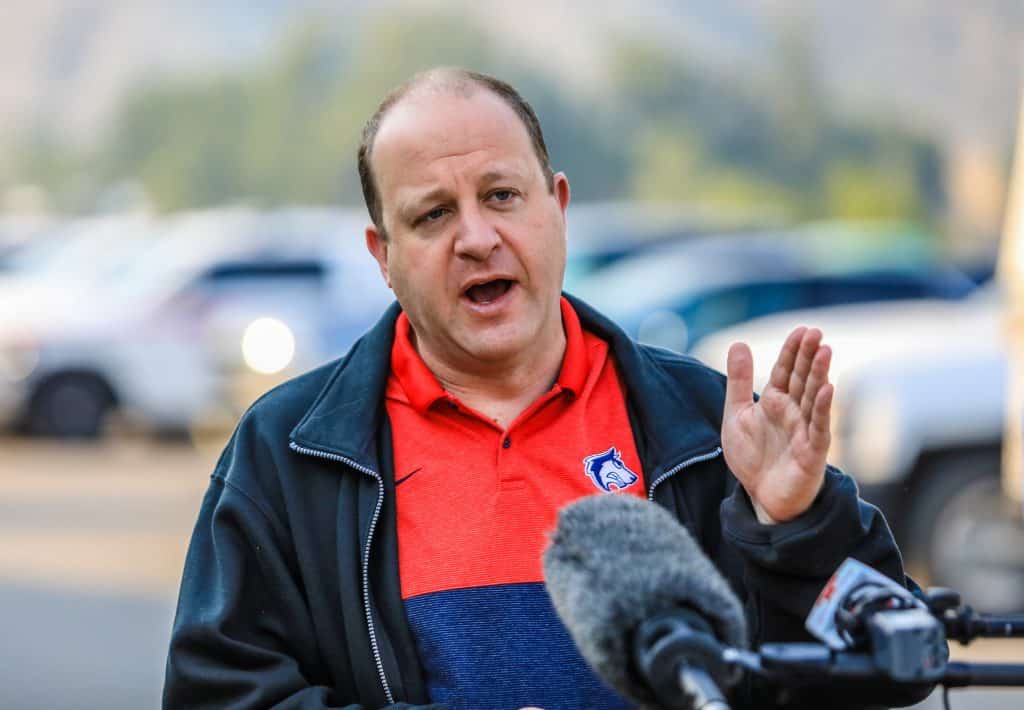 Colorado Gov. Jared Polis speaks to the media for updates on the Grizzly Creek Fire Friday at the Eagle County Fairgrounds in Eagle. The fire is now more than 14,000 acres and at 1 percent containment.