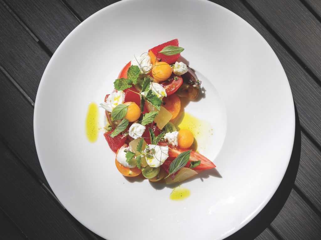 Garden tomato salad, summer melon, basil and mozzarella.
