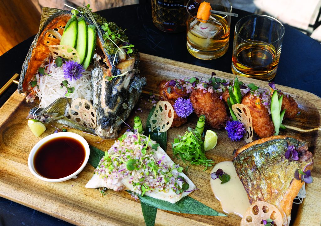 Whole shima aji (striped jack) presented four ways, clockwise from back left: Chimichurri, Coco Loco, Classic and Sesh-Juan.