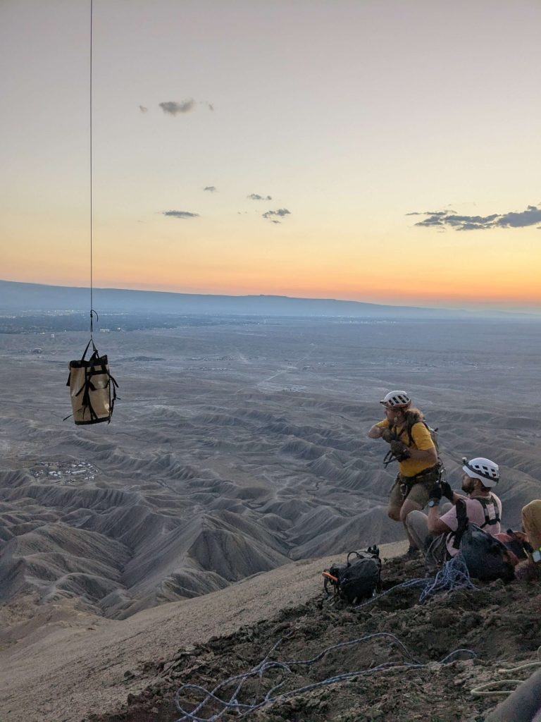 A Mesa County Search and Rescue volunteer prepares to receive a drop bag.