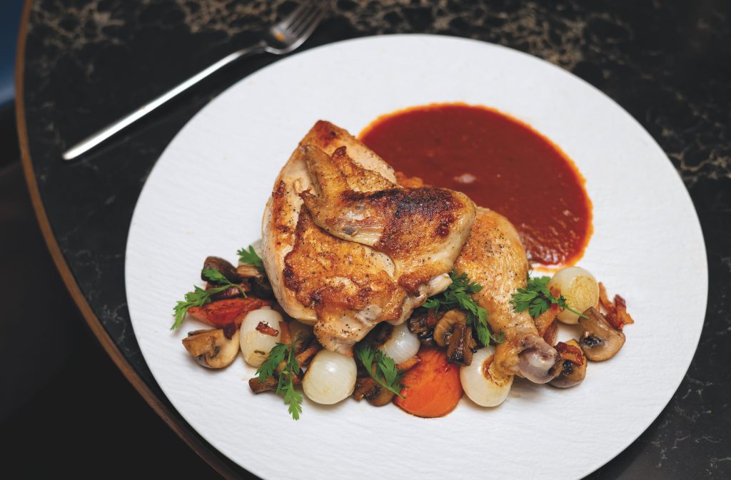 Roasted Chicken "coq an vin" with Joyce Farms chicken, guanciale, pearl onion, carrot, cremini and pinot noir.