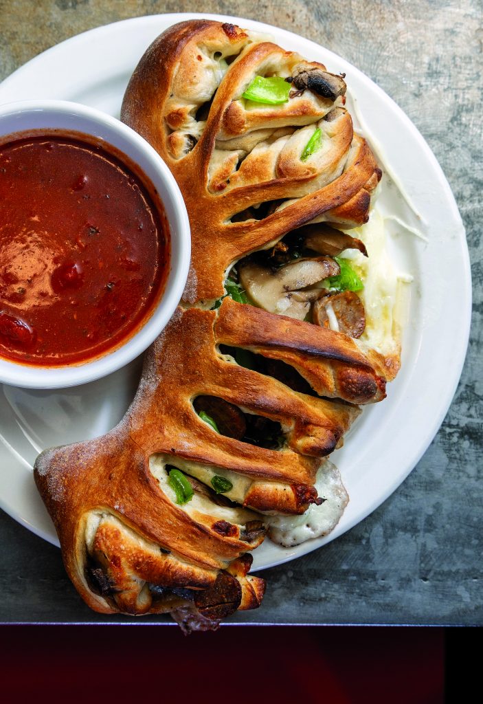 Classic stromboli stuffed with spicy Italian style sausage, mushrooms, green peppers, onions and mozzarella cheese.