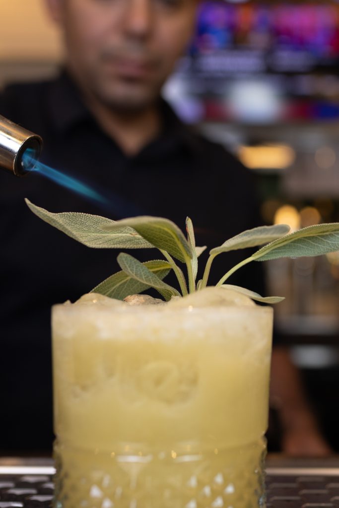 El Cartel with bourbon, fresh lime juice, Yellow Chartreuse, agave and sage.