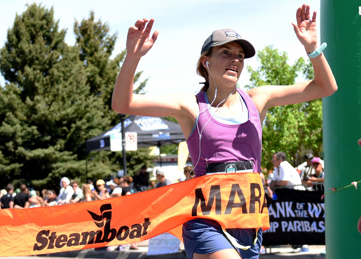 Ali Kelley crosses the finish line on Sunday to win the Steamboat Marathon.