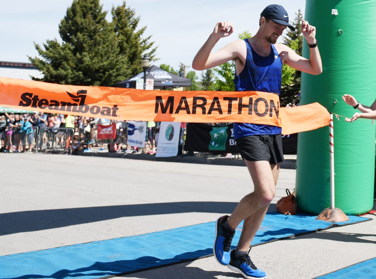 Dylan Jennings crosses the finish line Sunday to win the Steamboat Marathon.