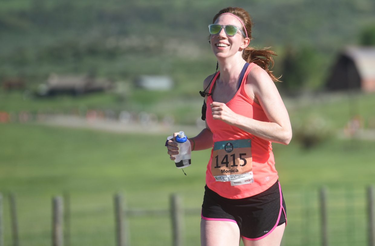Denver's Monica Howard smiles wide during the half marathon Sunday at the Steamboat Marathon. 