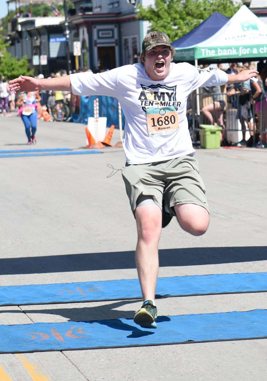 Rowan Plavec finishes his half marathon with authority on Sunday during the Steamboat Marathon.