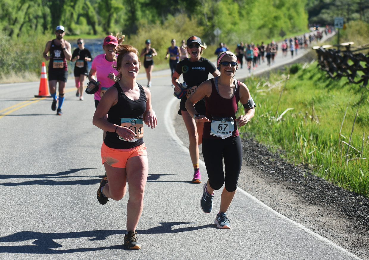 Caitlin Murphy, left, and Rachael Delahoyde lead a pack of runners on Sunday during the Steamboat Marathon.