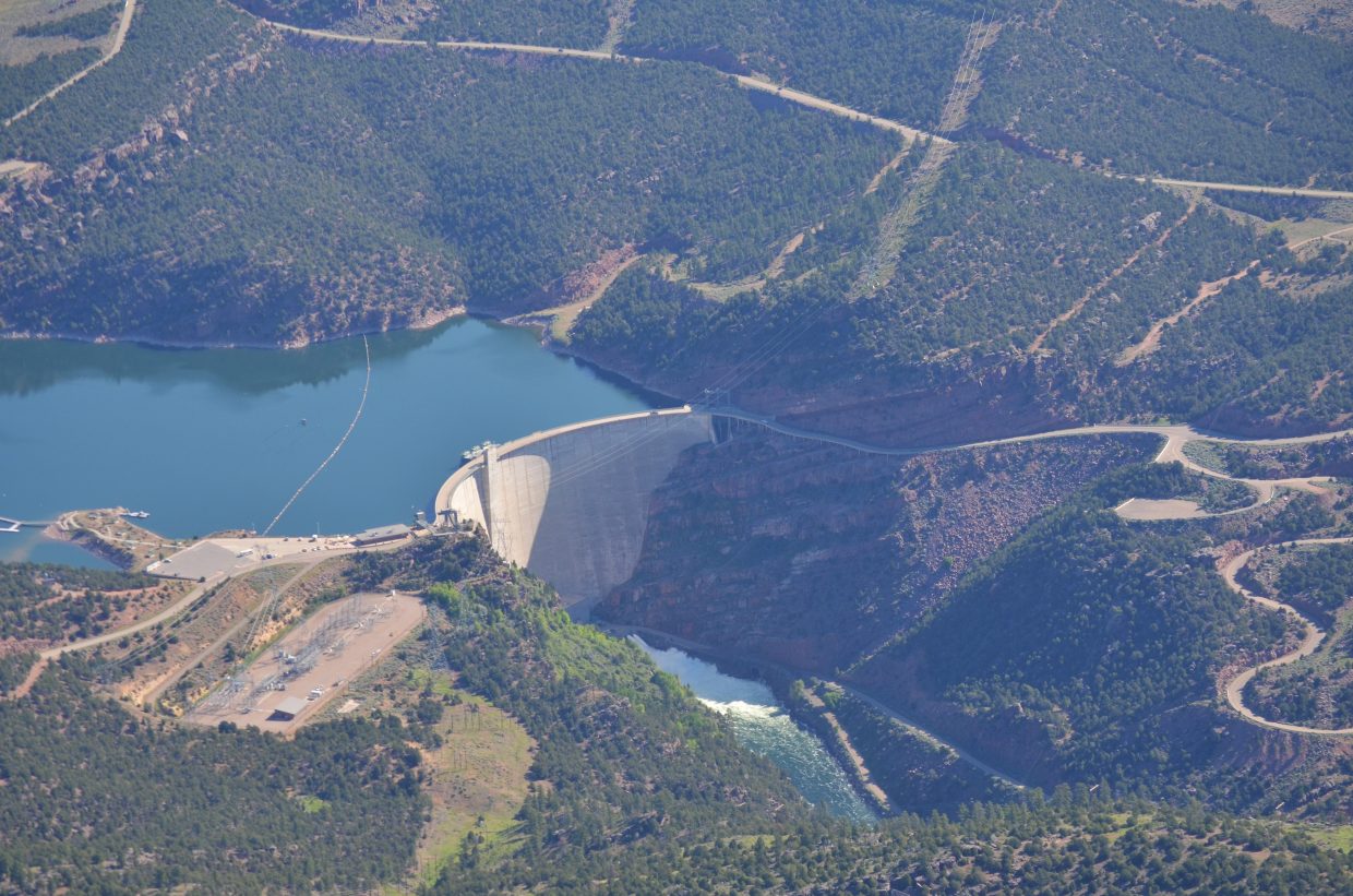 A roaring plume of whitewater flows through bypass valves at Flaming Gorge Dam in Utah as its managers follow through with plans to ramp  flows up to 8,600 cubic feet per second on June 5. The Green's near record flows will blend with the slightly below average flows of the Yampa River in Dinosaur National Monument.