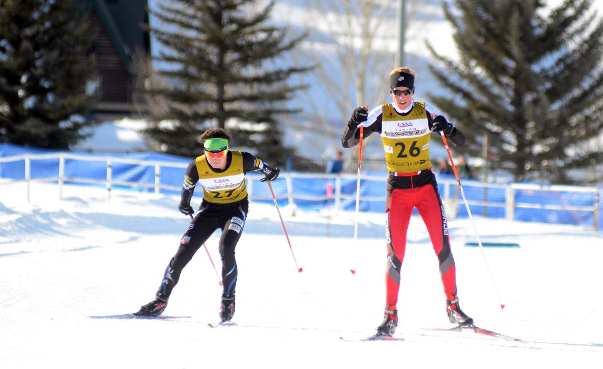Rocky Mountain Division's Nicholas Madden, left, and Intermountain Division's Somer Schrock come down the final stretch of Lap 1 during their thrilling U20 men's Nordic combined Junior Nationals race on Thursday. The two exchanged leads throughout the three-lap course, but it was Madden who outlasted Schrock for the Nationals victory.