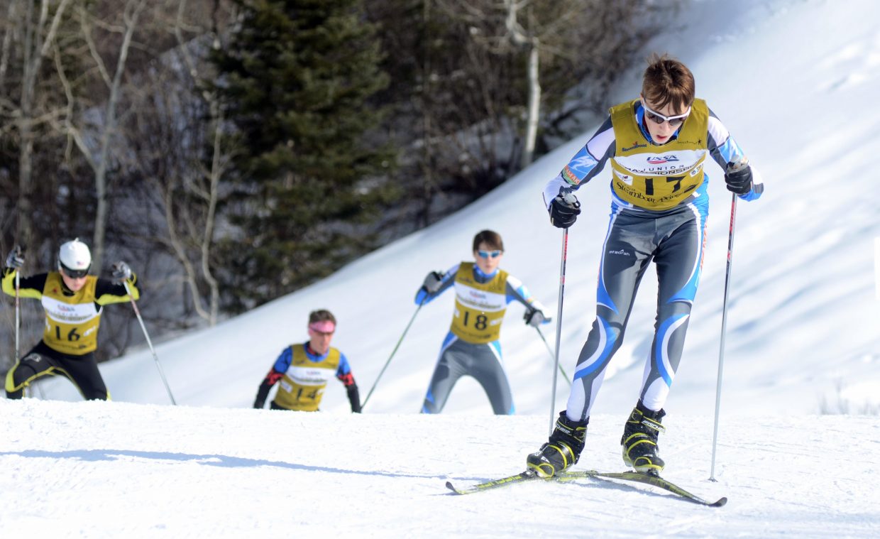 Alaska Division's Eli Hermanson slides ahead of his pack of competitors in the U16 men's Nordic combined class Thursday.