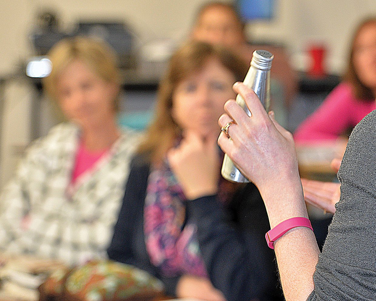 Kate Elkins from Grand Futures Prevention Coalition holds a bottle of marijuana-infused drink while speaking to the Parent Information Committee about marijuana during a recent meeting. She helped educate the parents about the new laws regarding marijuana and how it impacts students and the schools. She also reviewed the many different products, including this marijuana infuses drink, that are offered by legal marijuana shops in Steamboat, and what parents need to learn about when it comes to dealing with their children and marijuana.