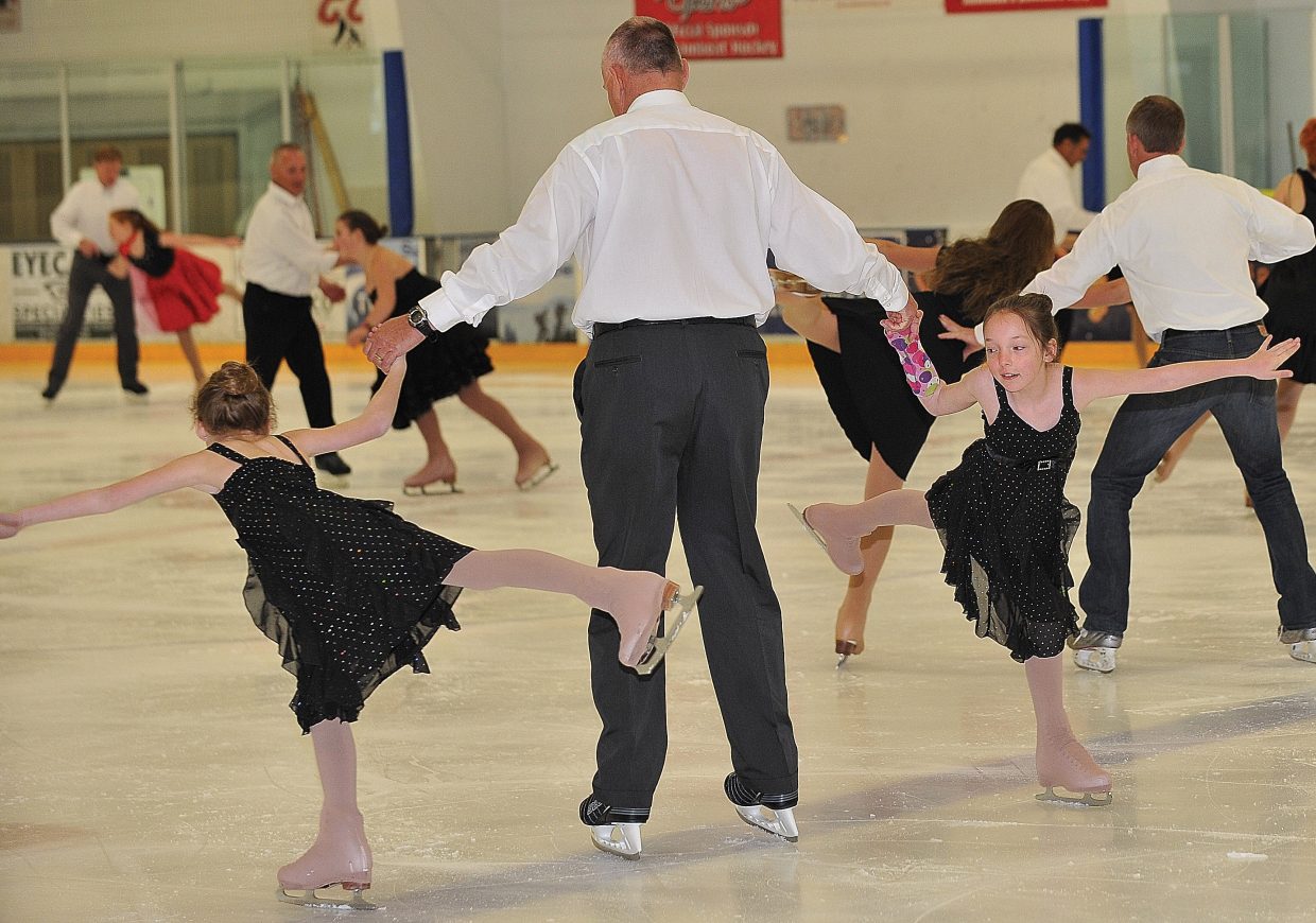 Mike Curzon gets spun around the ice by family friend Soren Brockway, left, and his daughter Natasha Curzon while rehearsing a father-daughter act in the Steamboat Springs Figure Skating Club's "Broadway on Ice" show.