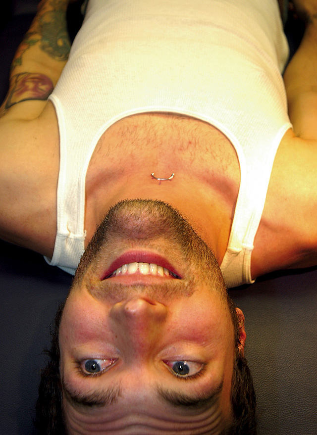 Bucky Jaquess mentally prepares for a piercing by Ryan Lee.