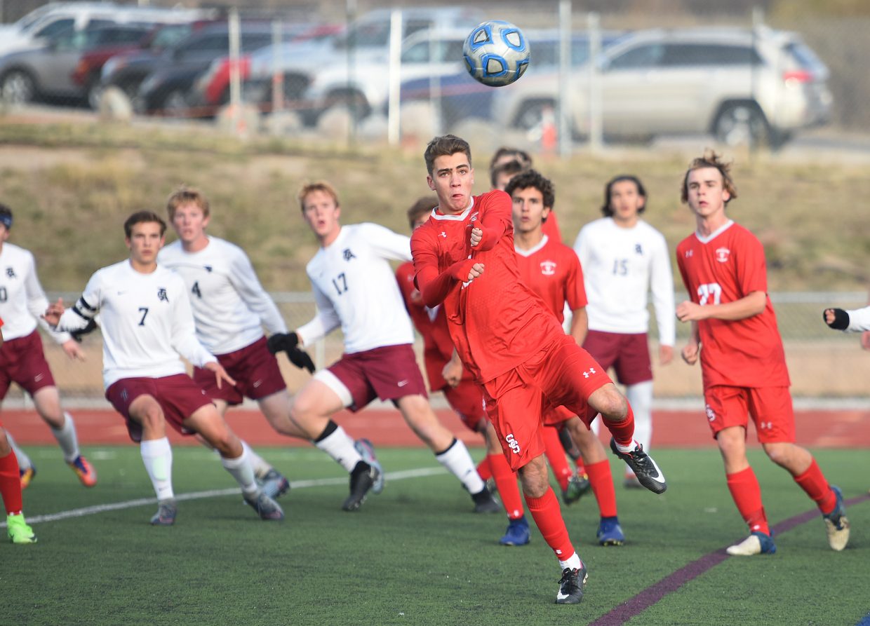 Steamboat’s Murphy Bohlmann keeps his eyes on the ball Tuesday against The Classical Academy.