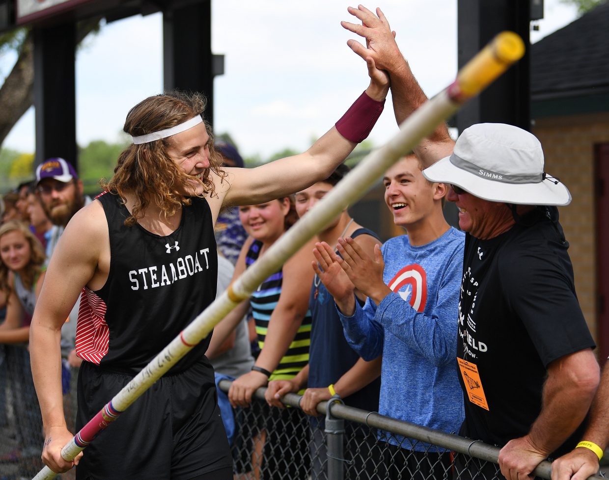 Eric Casey celebrates during the 3A boys pole vault event.