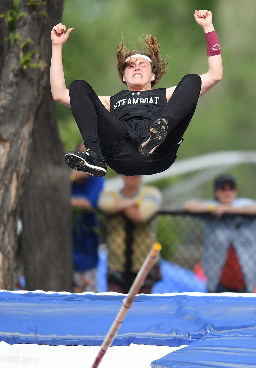 Steamboat Springs junior Eric Casey clinches his fists in celebration as he falls to the mat after clearing 14-0 in the Class 3A boys pole vault evnet at the state track and field championships in Lakewood.