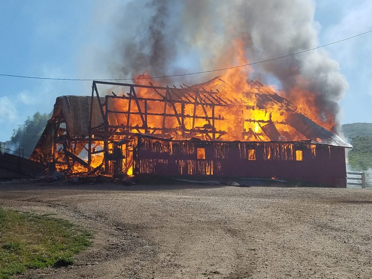 Firefighters battle a barn fire in North Routt County  Monday morning. The blaze destroyed the historic barn on the Circle Bar Ranch.