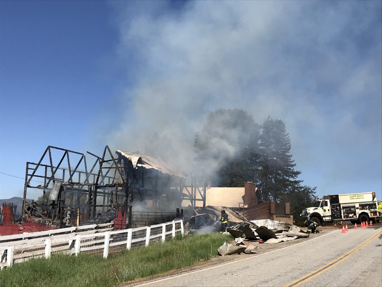 Firefighters battle a barn fire in North Routt County  Monday morning. The blaze destroyed the historic barn on the Circle Bar Ranch.