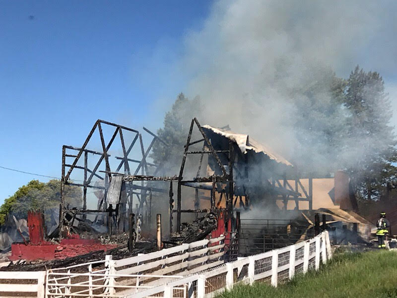 Firefighters battle a barn fire in North Routt County  Monday morning. The blaze destroyed the historic barn on the Circle Bar Ranch.