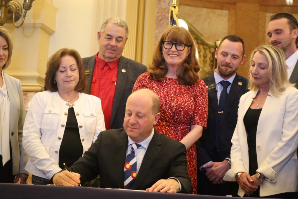 Polis signs bill aimed at easing regulatory burdens on Colorado businesses