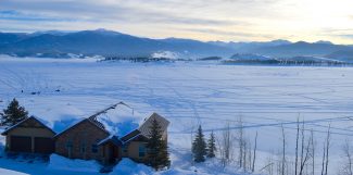 The sun rises over the Continental Divide in Grand County Sunday morning as anglers and competitors in the Three Lakes Ice Fishing Contest take to the ice once again to try their luck.