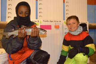 Young Sam Welch (left) displays his winning catch Sunday morning at the North Shore Resort Weight Station as his fishing partner and best friend Ritchard (Ricky) Fortinato looks on. The two boys were very successful during this year’s tournament with Sam sitting in first place in the 10 to 14-year-old age division Sunday.