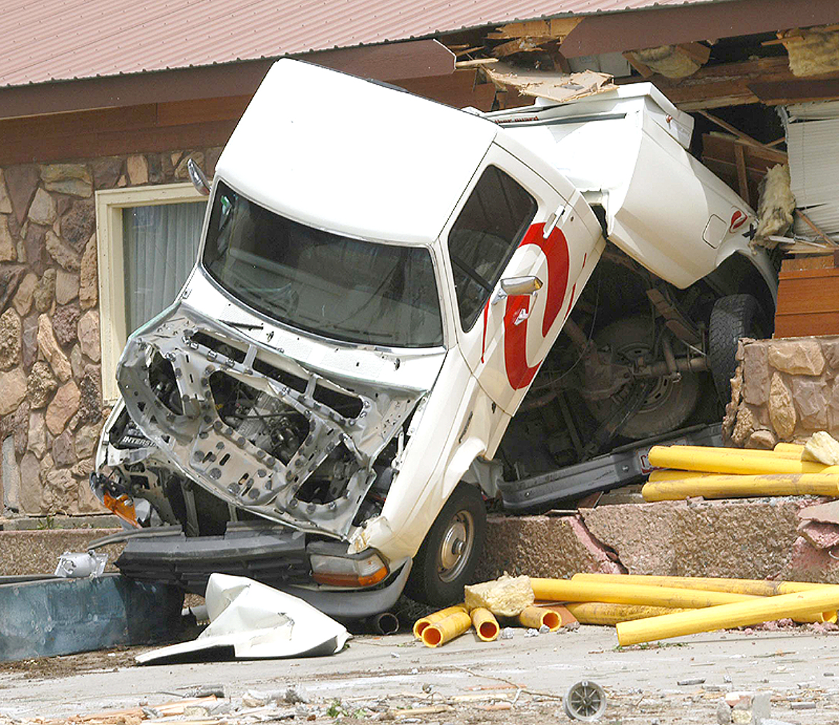 An Xcel Energy truck that was crushed by the bulldozer is pictured in the aftermath of the attack. 